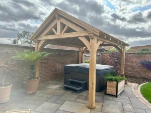 Elegant oak pavilion with a sturdy frame, perfect for outdoor gathering