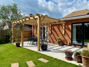 Elegant oak lean-to pergola 5m x 3.5m perfect for creating a cozy outdoor sitting area