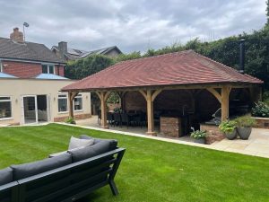 Elegant oak gazebo with hipped roof, measuring 4.5 x 9 meters