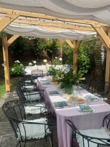 Oak pergola with a clear roof, providing shade and light