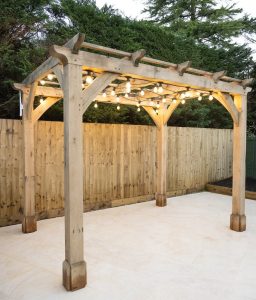 Large oak pergola with trellis, perfect for creating a stylish and private outdoor space