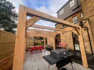 Custom oak pergola with a contemporary design, enhancing garden aesthetics