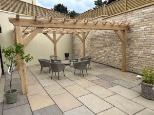 Solid oak pergola design with strong beams, customizable features like lattice available