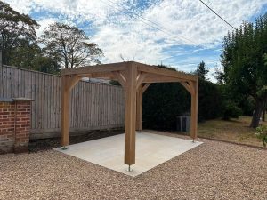 Contemporary oak pergola featuring clean lines and a natural solid oak frame