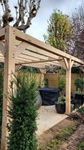 Elegant modern oak pergola providing shade and style for outdoor spaces
