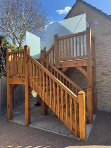 Oak staircase with two flights and an intermediate landing