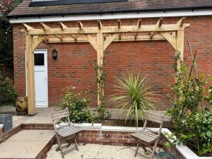 CNC cut oak frame construction with beams and joints ready for assembly pergola or porch