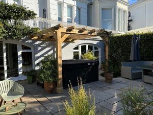 Oak lean-to pergola with a simple and sleek design, providing outdoor shelter