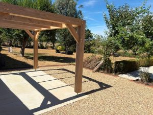 Modern oak pergola without roof overhangs featuring a clean rectangular frame