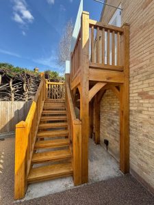 Oak return staircase with a sharp 180-degree change in direction.