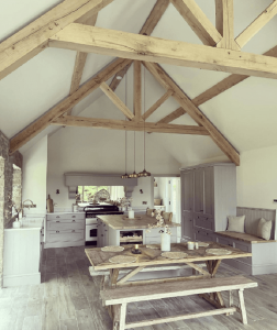 Architectural rendering of an oak raised tie shaped king post truss in a modern building