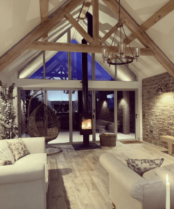 Elevated oak king post truss installed in a spacious interior, demonstrating its aesthetic appeal