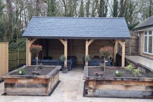Elegant oak pavilion with a spacious design in a garden setting