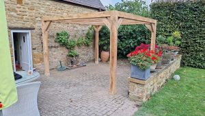 Oak modern pergola kit in the UK, offering a sleek and stylish outdoor structure