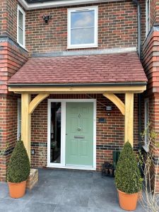 Stylish oak pent roof porch with a sloped roof, designed for a modern home entrance