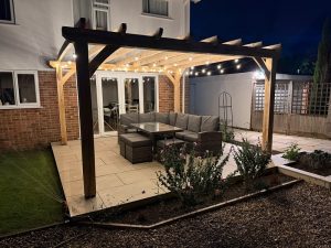 Oak pergola with integrated lighting for evening garden entertaining