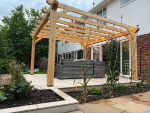 Traditional oak pergola featuring solid oak posts and classic timber joinery