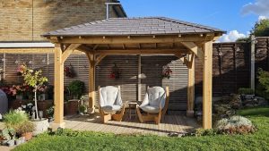 Detail of the hipped roof on a solid oak gazebo with composite roof tiles
