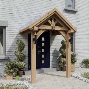A beautifully constructed two-legged oak porch featuring two robust oak posts and a dwarf wall, enhancing the entrance of a charming home