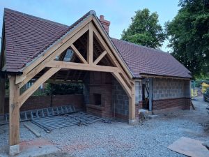Custom oak gazebo featuring a hipped roof and spacious open design for outdoor gatherings.