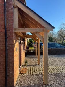 Enhance your patio with a bespoke oak lean-to gazebo, complete with a stylish slate roof.