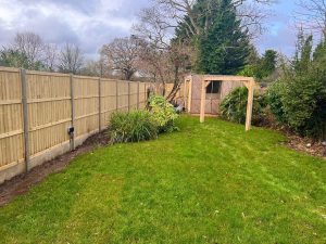 Handcrafted oak swing frame with a timeless design for garden enjoyment.