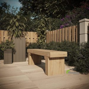 Outdoor oak bench made from solid timber placed in a garden seating area